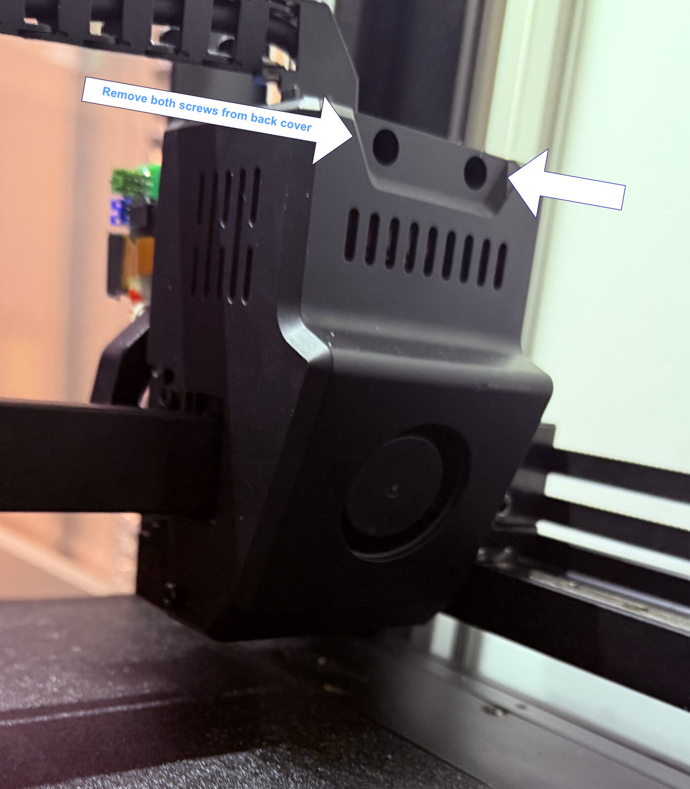 The two screws on top of the toolhead's back cover